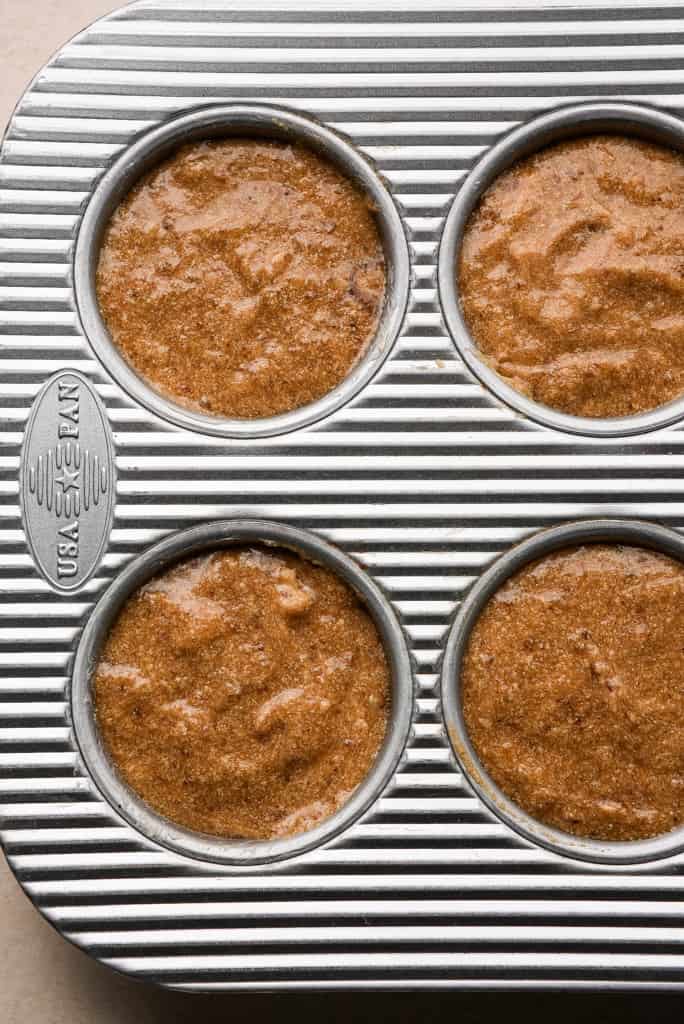 sticky toffee pudding batter added to muffin pan